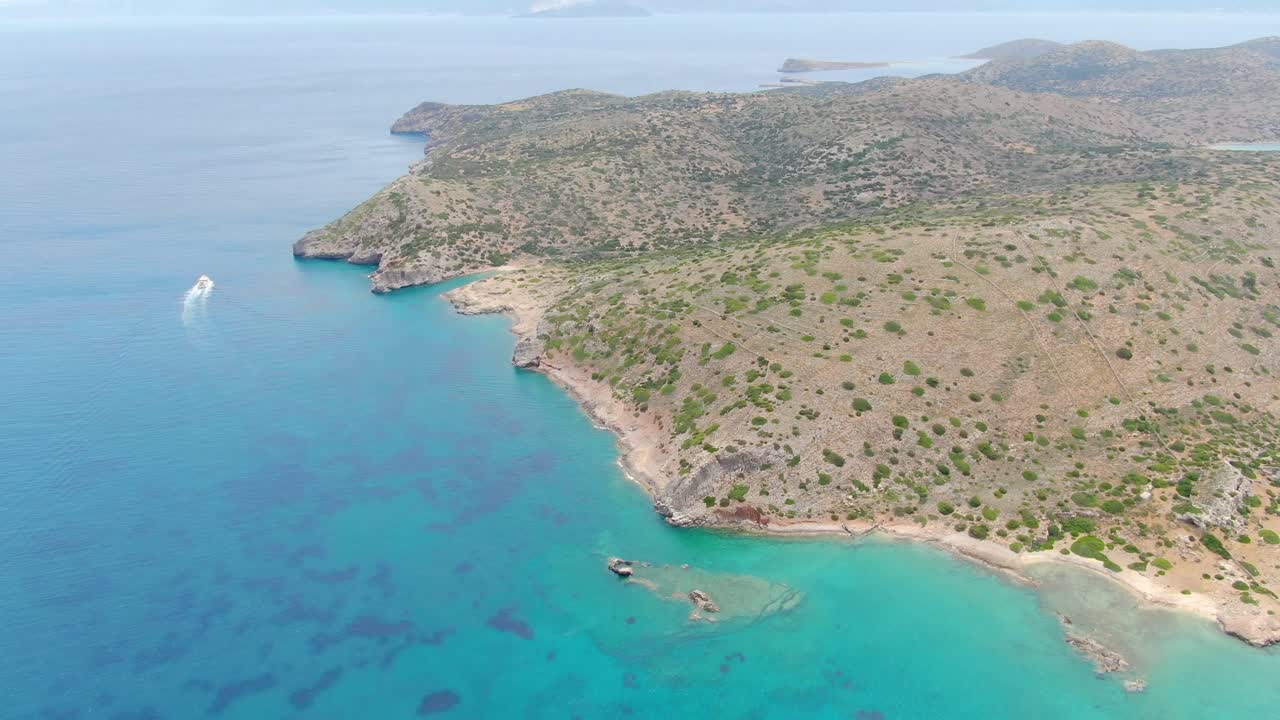 Aerial tilt up Mediterranean sea off Crete Island . Turquoise paradisiac waters