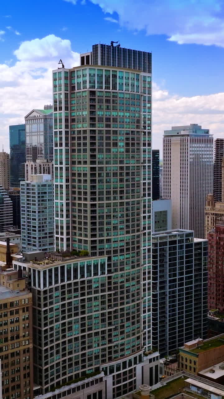 Impressive skyscrapers of Chicago city. Drone footage among the amazing diverse buildings of metropolis. Vertical video