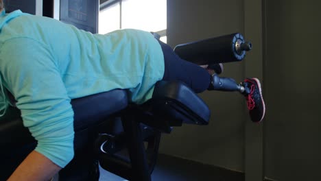 senior woman exercising on curl machine 4k
