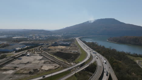 aerial footage flying towards lookout mountain that has a forest fire on it's slopes.