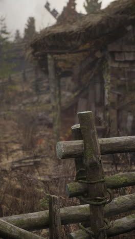 old abandoned house with wooden fence