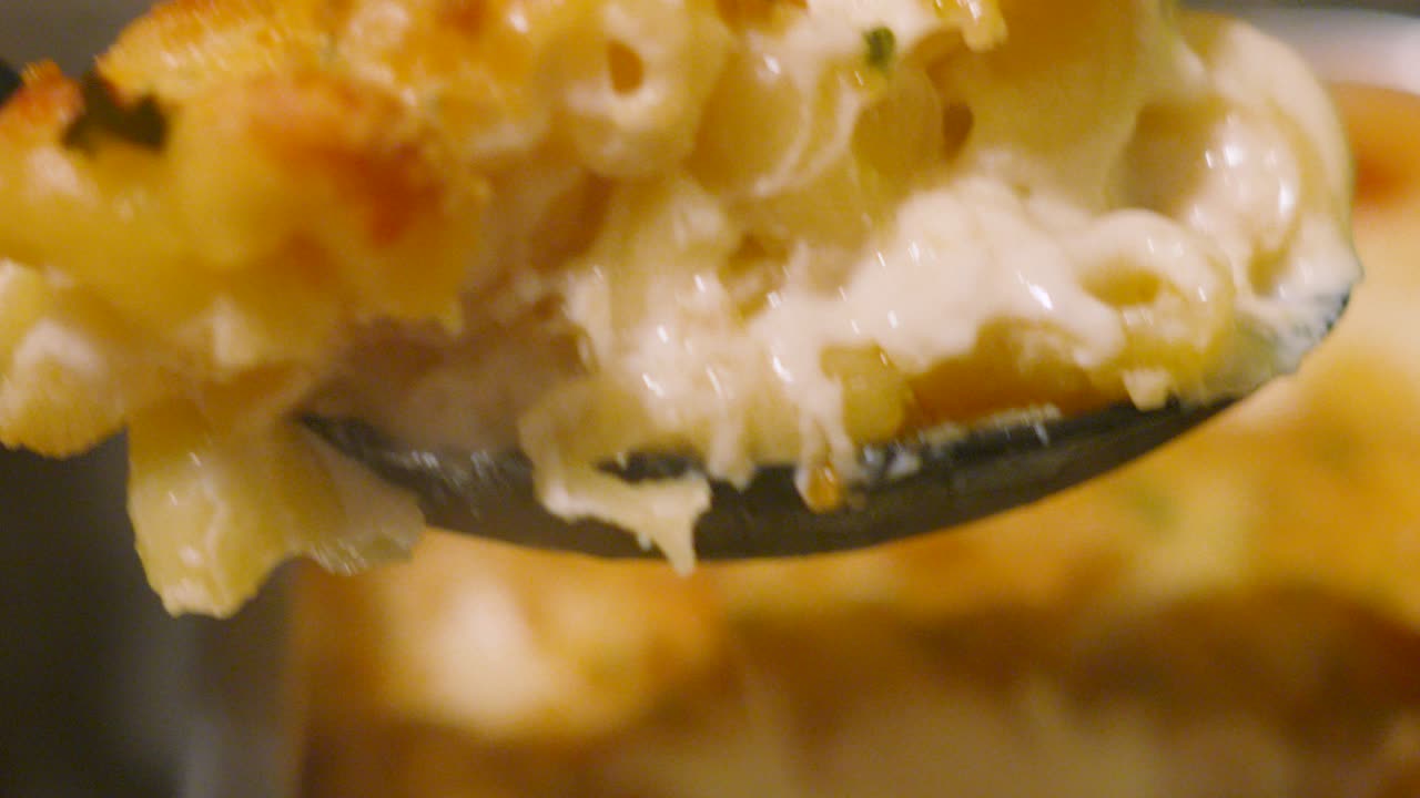Slow Motion Clip of Serving Spoon Picking Up Delicious Macaroni Cheese. Pasta Based Dinner Food Meal Footage