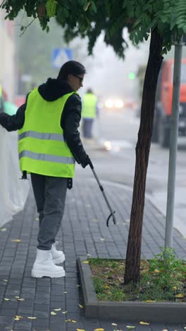 street cleaner picking up litter