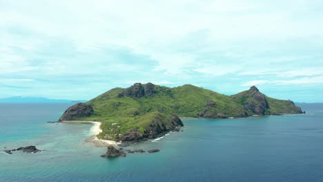 the beautiful fiji mountain island surrounded by crystal clear waves of the sea - aerial