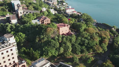 fort santo domingo amid lush greenery with coastal city backdrop from aerial view