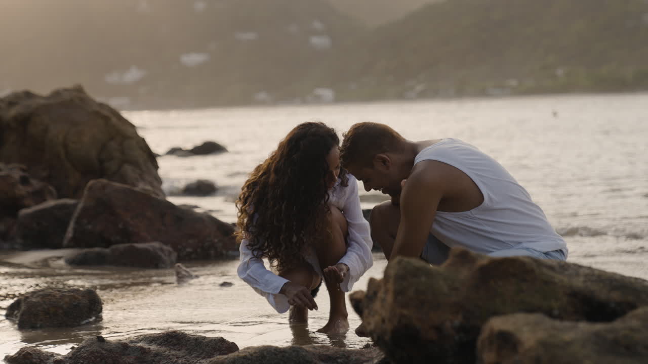 Couple at the rocky seashore