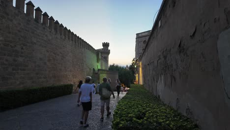 time lapse of palma de mallorca’s historic center with a view of ciudadela and walls at dusk in a summer night with people strolling. 4k