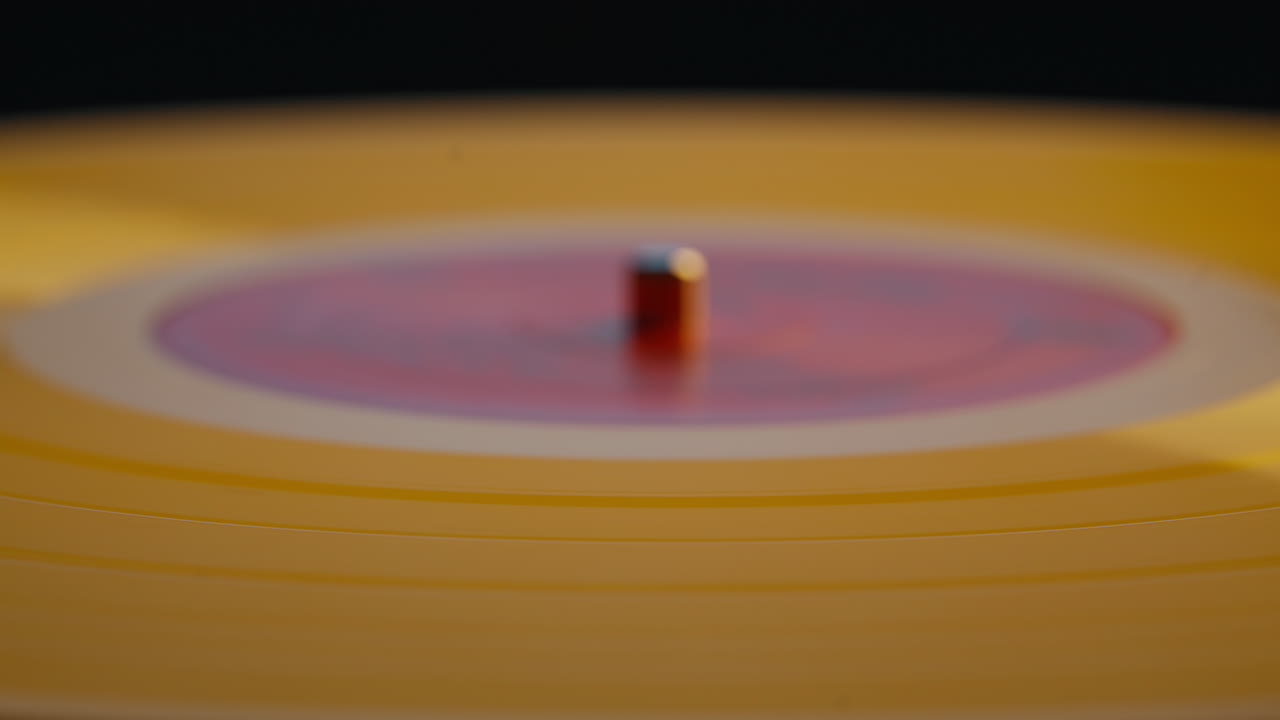 Classical music vinyl rotating on vintage turntable in home apartment closeup
