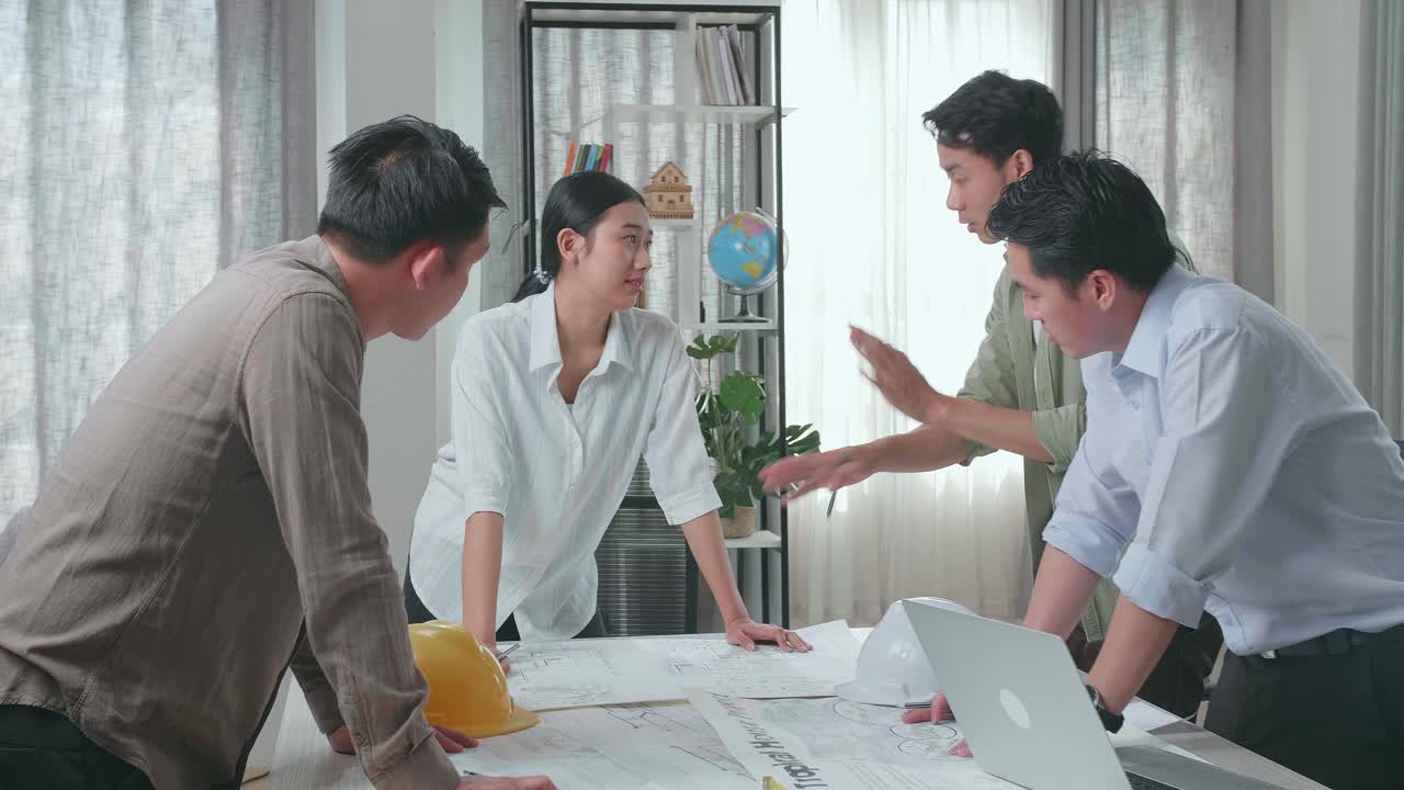 Serious Group Of Asian Engineers Discuss About Work At The Office, Angry Colleagues Debate Fight Over Paperwork