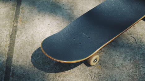 skateboard on a concrete background at a skatepark in the summer