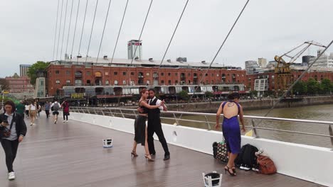 tango argentine dancers perform on puerto madero, busking travel spot