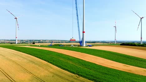 Wind-Turbine-Construction-Site-In-Summer---drone-shot