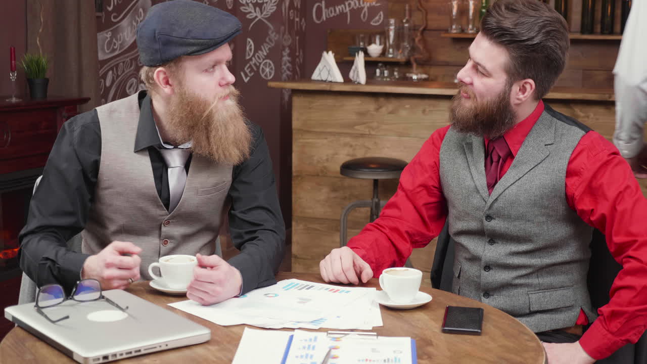 Men drinking coffee in a cafe