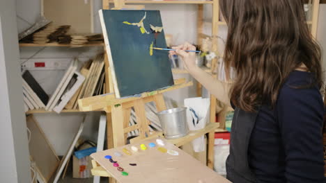 woman painting in an art studio