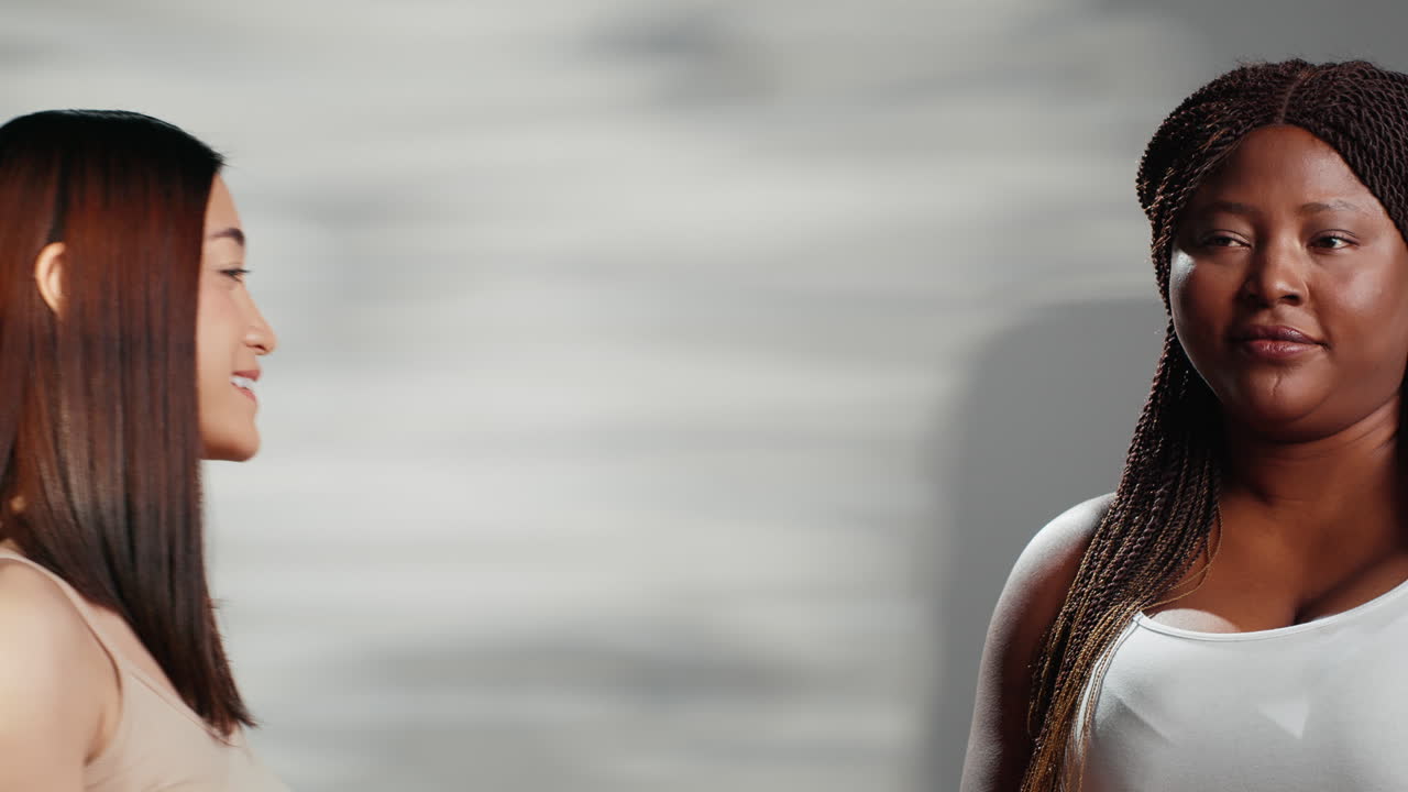 Two Diverse Women Smiling Together