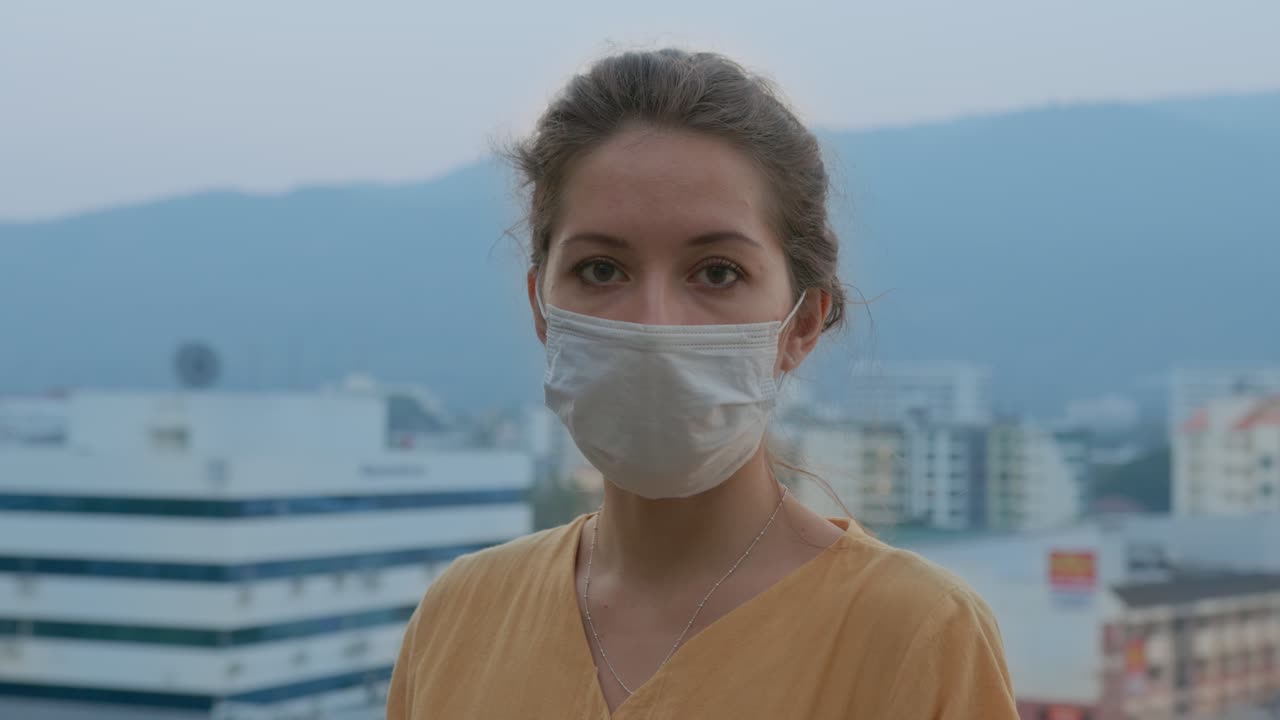 Woman Wearing a Mask in a City