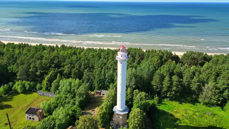 aerial of lighthouse tower structure on the baltic sea coast in latvia