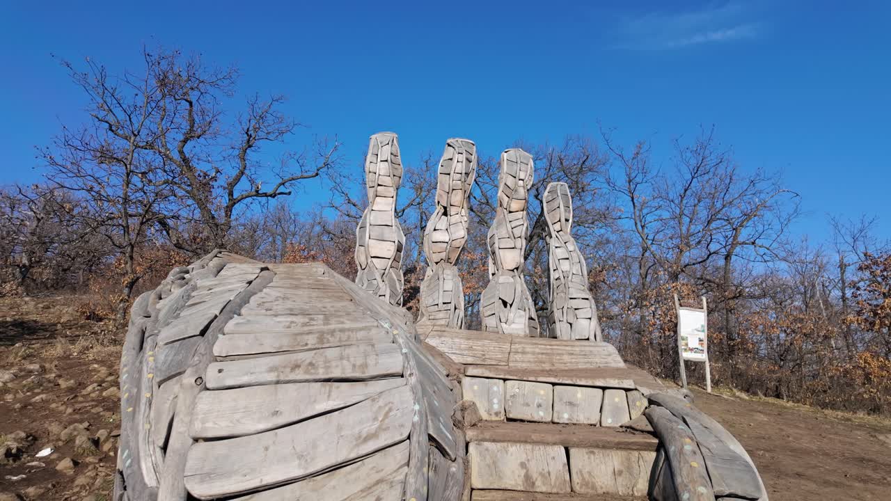 Medium shot of Palm of God wooden tourist attraction during the day near Holloko, Hungary.