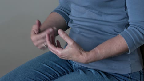 woman casually sitting using hands gestures in conversation