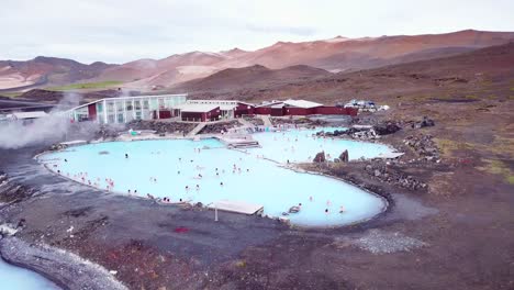 an aerial over a public thermal bath spa in iceland near myvatn editorial use only