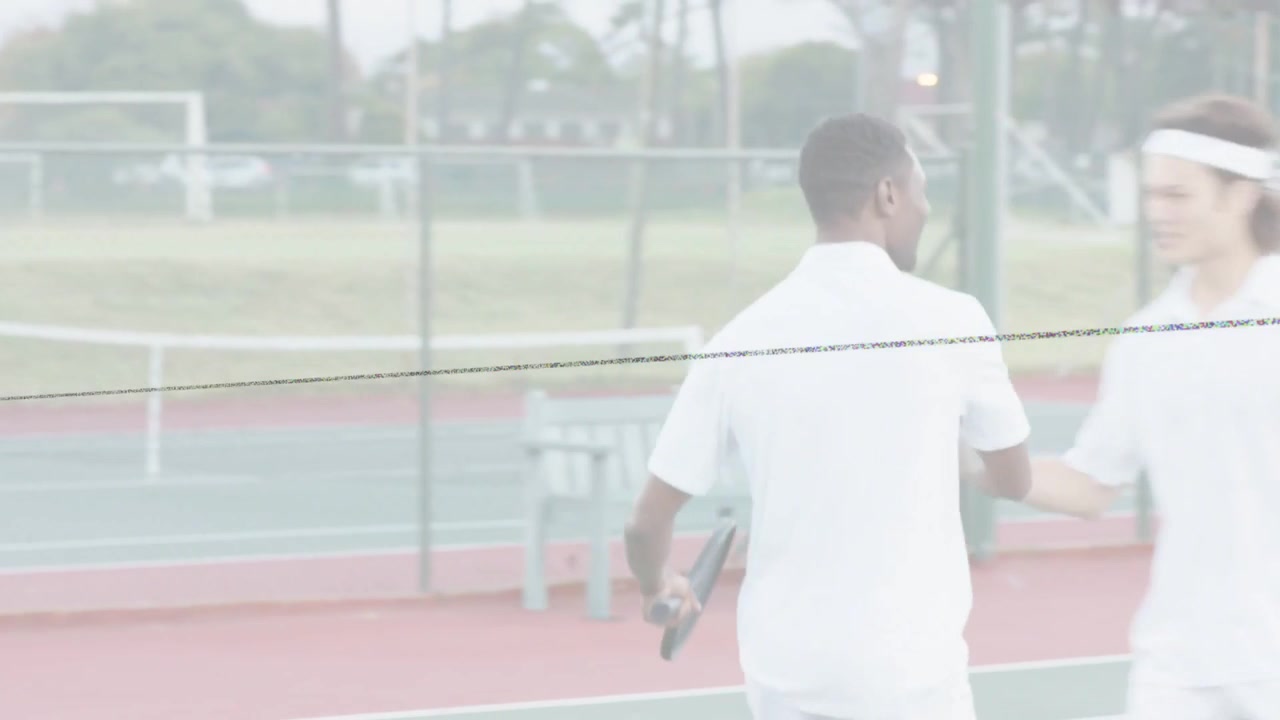Male tennis player tossing ball, serving with racket, moving toward net to end rally for sports