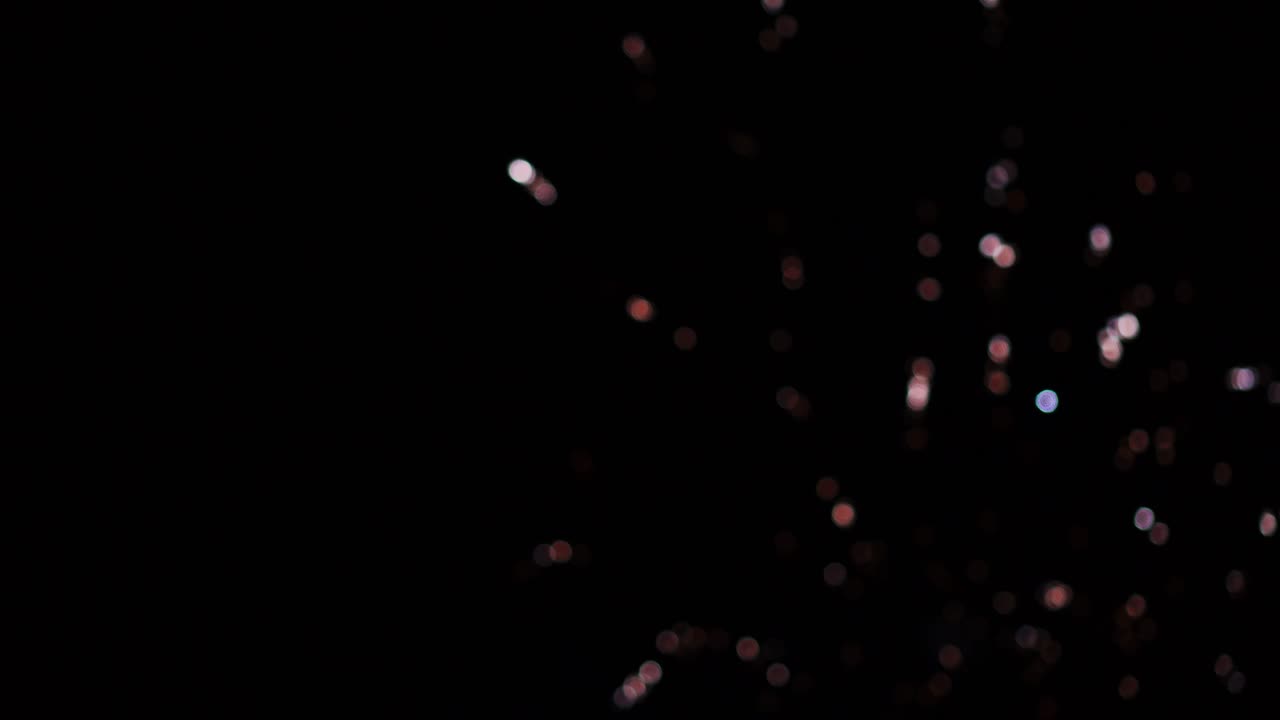 Fireworks with soft focus blurred lights on dark sky background