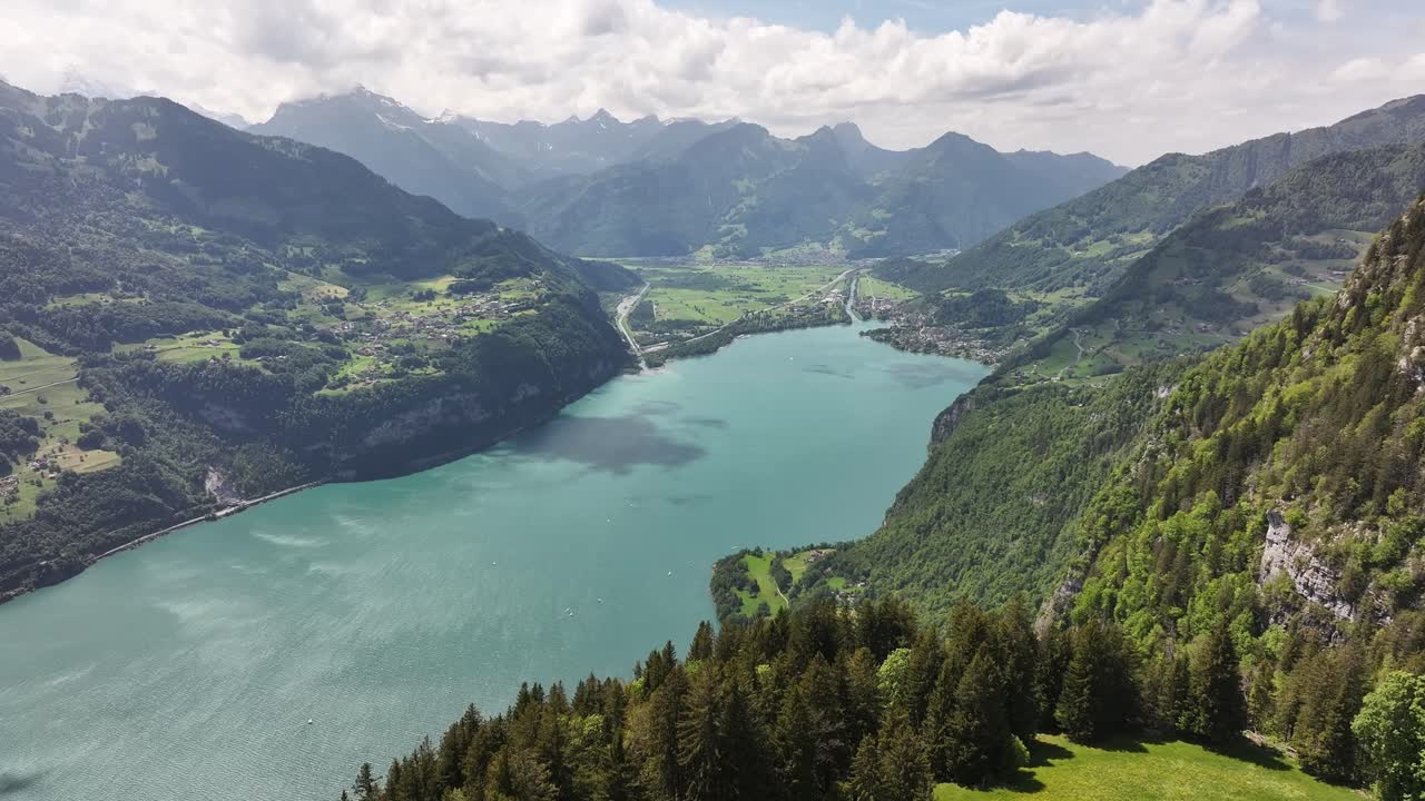 Aerial panorama of Walensee with alpine villages like Weesen, Amden, Quinten, Mols, and Walenstadt nestled in the Swiss mountains.