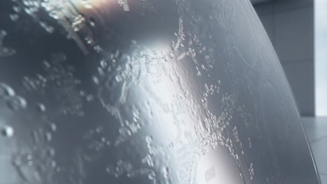 abstract reflective metallic surface with intricate pattern
