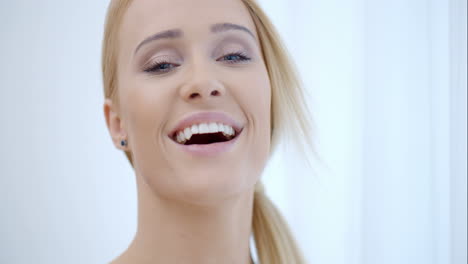 Pretty-Smiling-Woman-Behind-White-Curtain