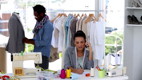 Pretty-fashion-designer-having-a-phone-conversation