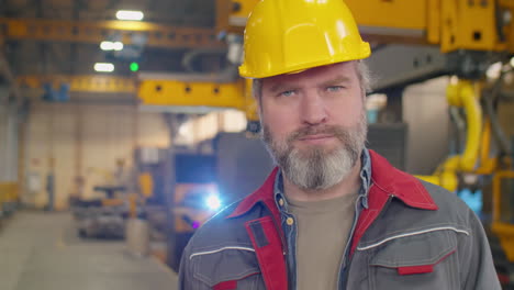 portrait of senior factory worker in hardhat