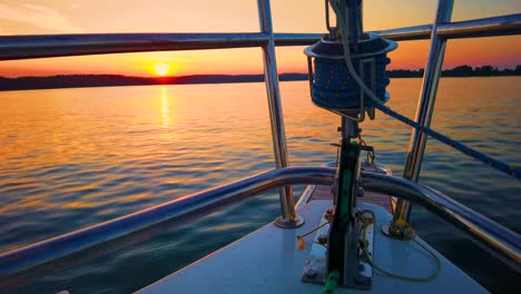 The-front-bow-of-a-white-sailing-boat-with-blue-sky-and-sea-background