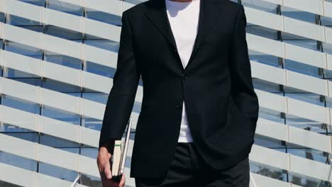 man in suit with books