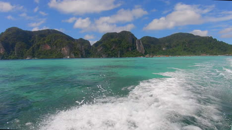 slow motion | wake from a boat in thailand with islands