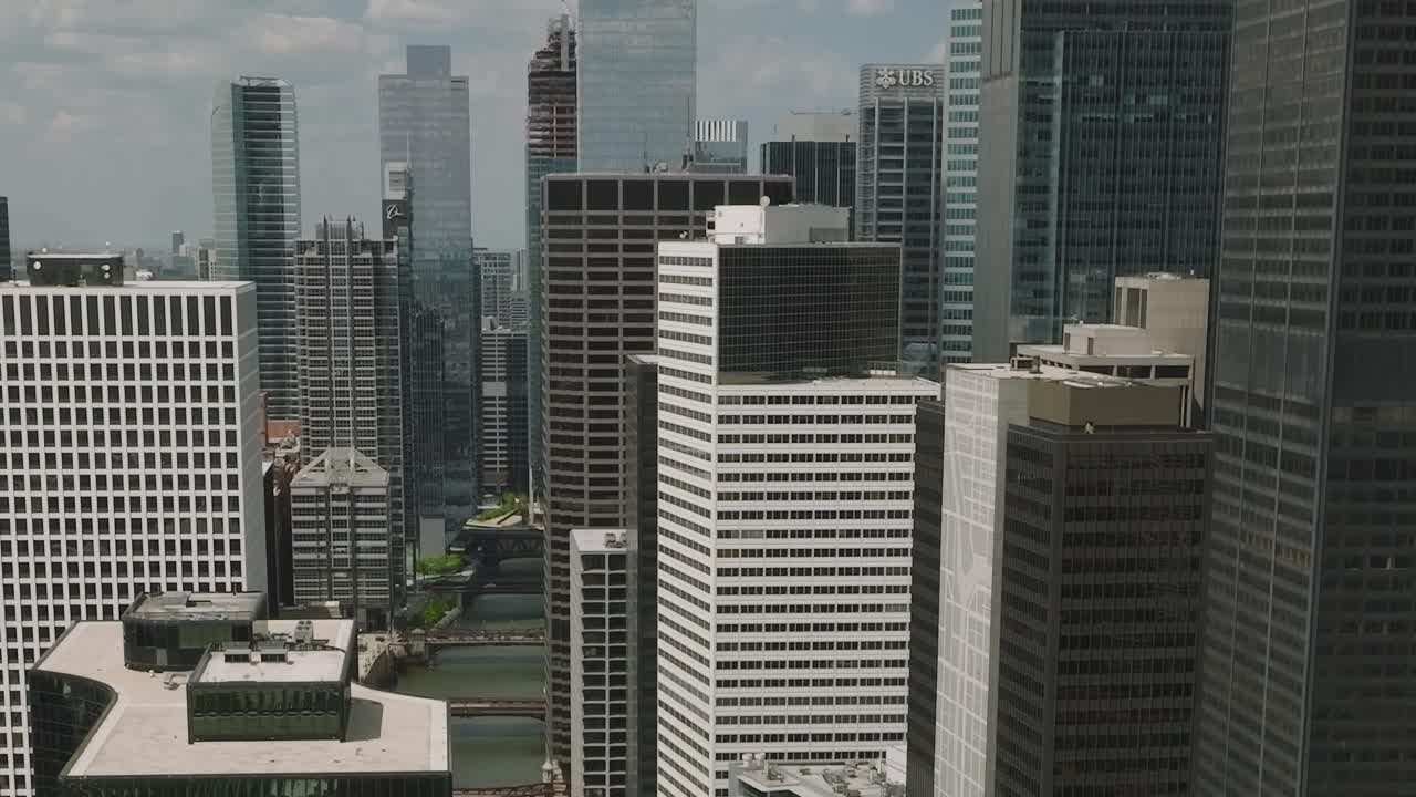 View of Chicago skyline shows tall buildings and city layout from above
