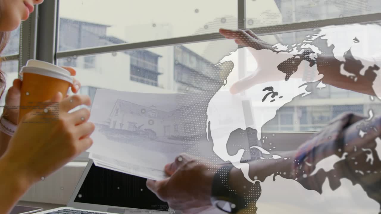 Colleagues reviewing design sketches while pointing and fanning pages, causing globe overlay