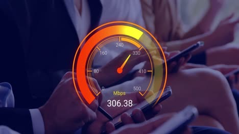 animation of orange speedometer over hands of diverse businesspeople with electronic devices