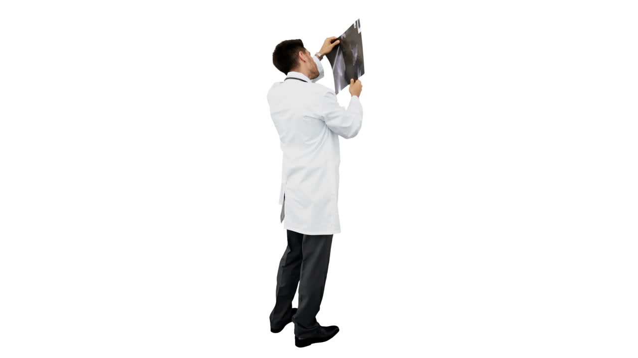 Young doctor standing with xray