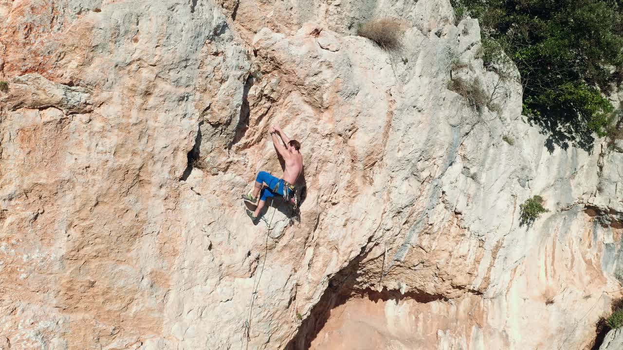 Rock climber climbing the rock 9