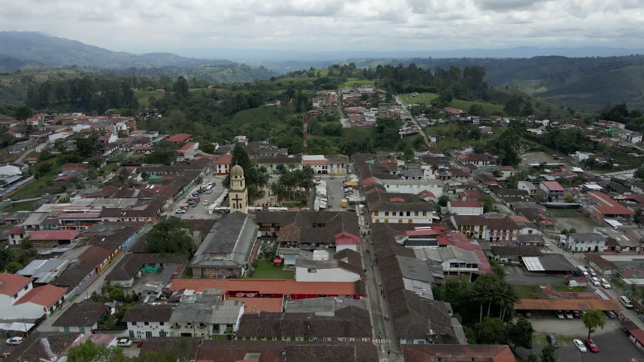 Aerial orbit approach to church in Salento, nestled in a green and tranquil urban landscape