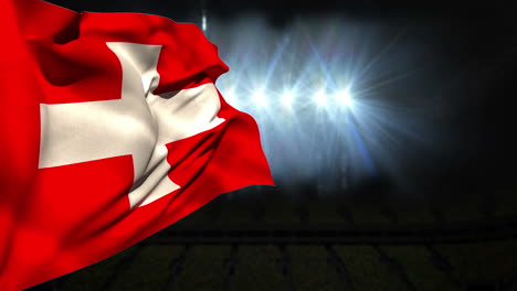 large swiss national flag waving