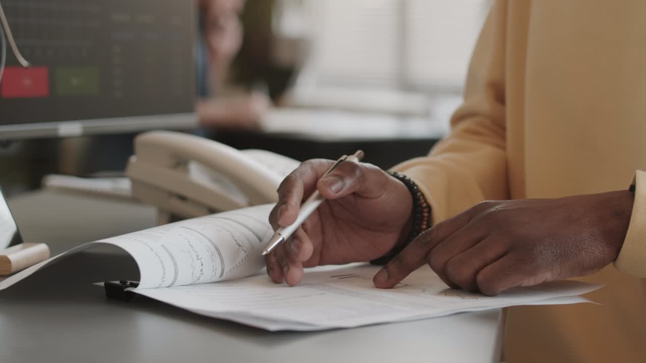 Financial Accountant Doing Paperwork in Office