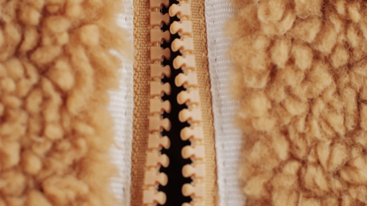 Footer textile cloth texture close-up macro. Fashion fabric multicolor. Sheep wool for clothes . High quality 4k footage