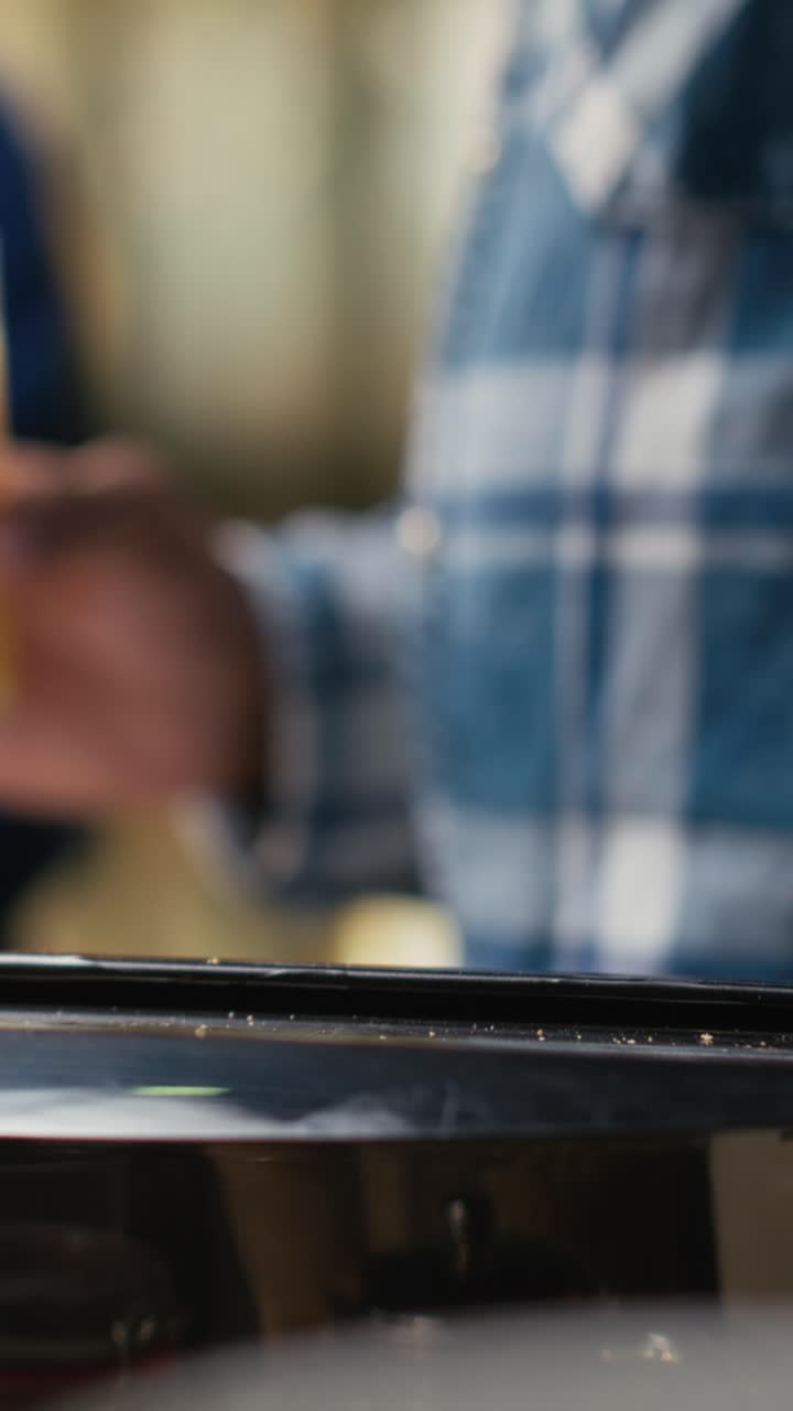 Vertical Video Jolly boyfriend and girlfriend taking bread out of toaster for breakfast meal