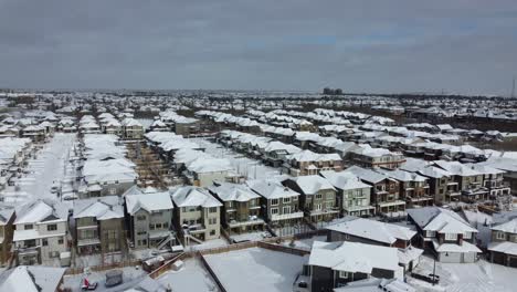 Aerial-view-of-a-suburban-community-in-Calgary,-Alberta-in-winter