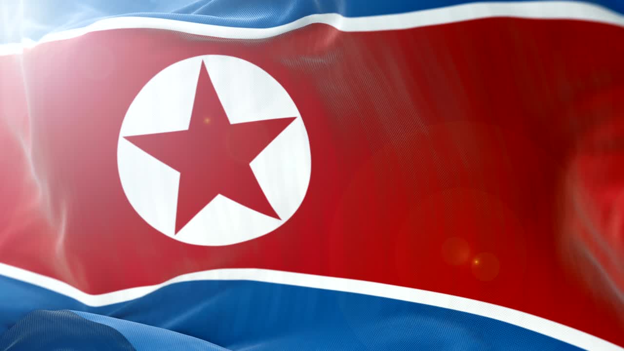 la bandera de corea del norte se agita lentamente en el fondo. 4k se agita de cerca la bandera. bucle sin costuras