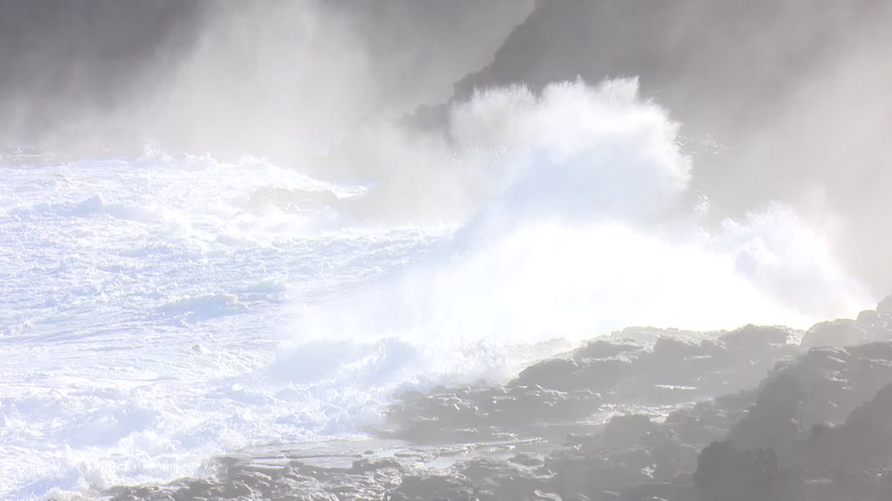 Powerful Waves Crashing on Rocky Coastline