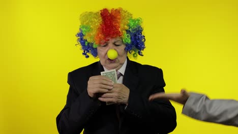 clown businesswoman entrepreneur in wig holds one buck money income and loses it