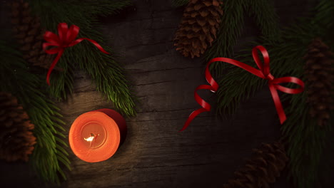 Animated-close-up-Christmas-candle-and-green-tree-branches
