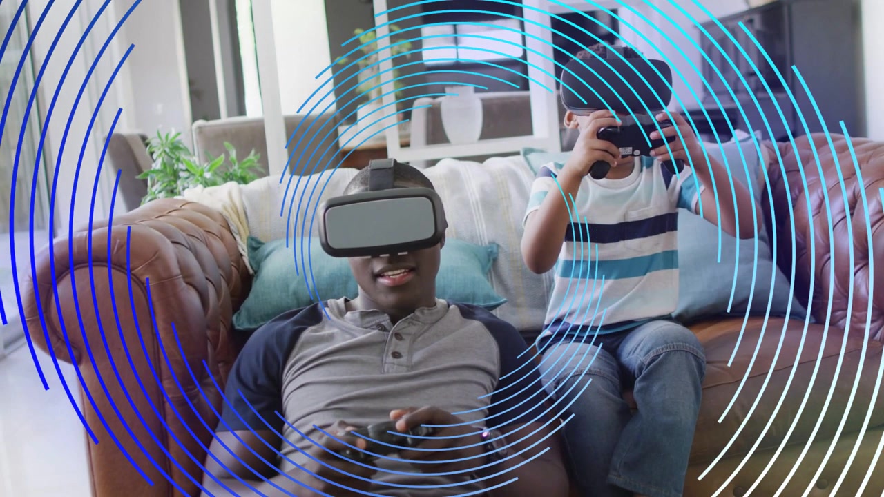 Father and son sitting on couch, child lifting headset, starting VR gaming as blue rings overlay